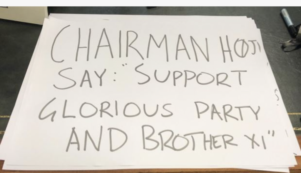 A close up of a sign

Description automatically generated